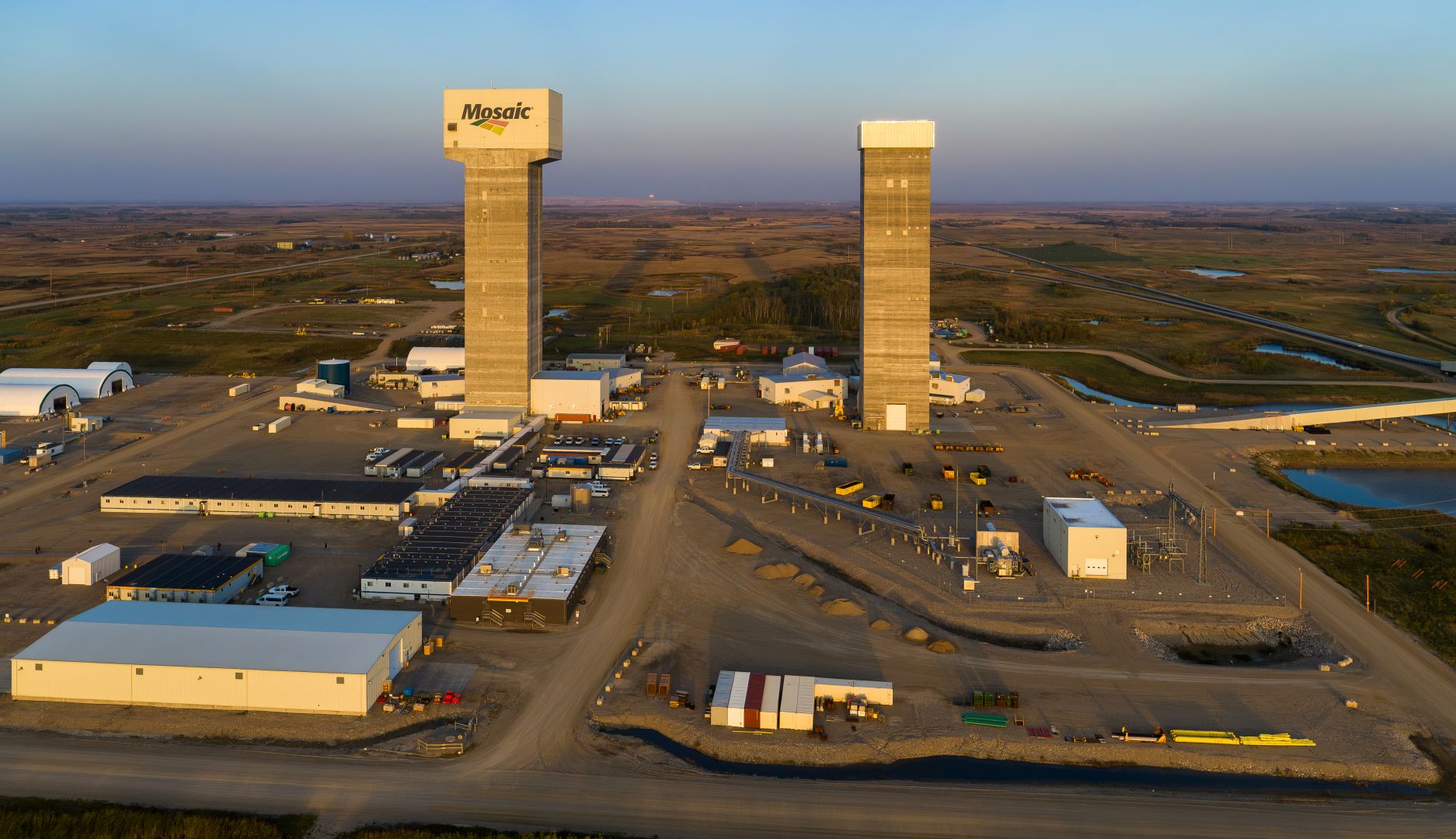 Potash mine workers in front of the potash K3 conveyor