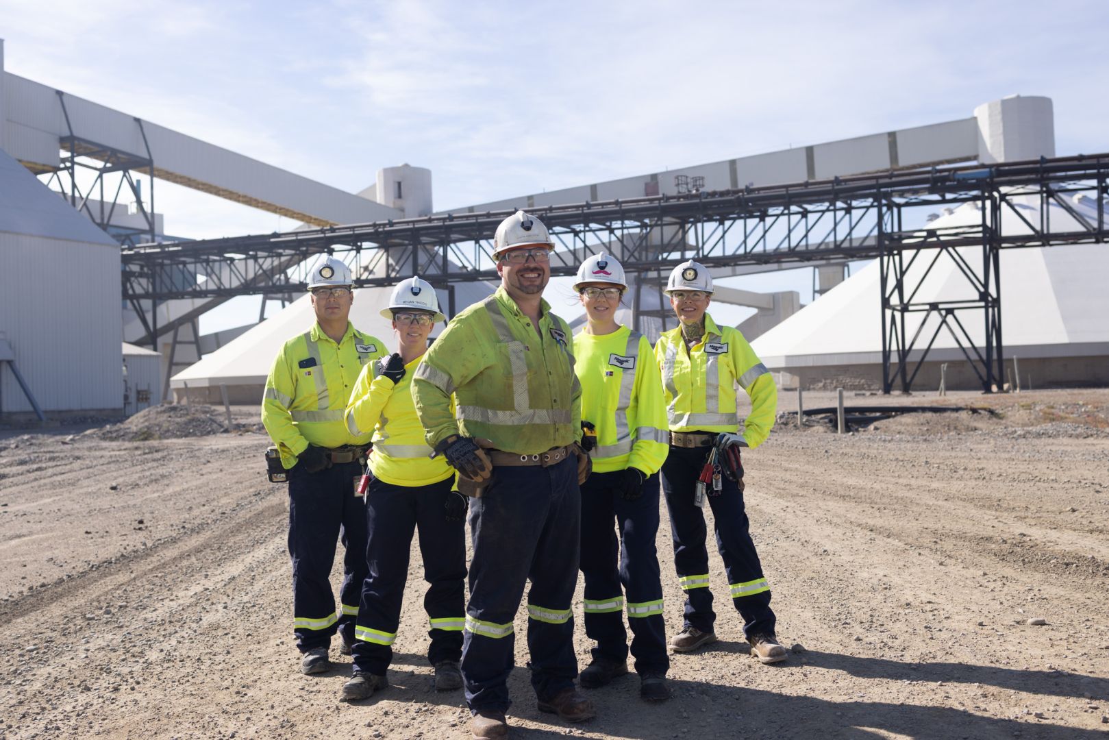 Potash mine workers in front of the potash K3 conveyor